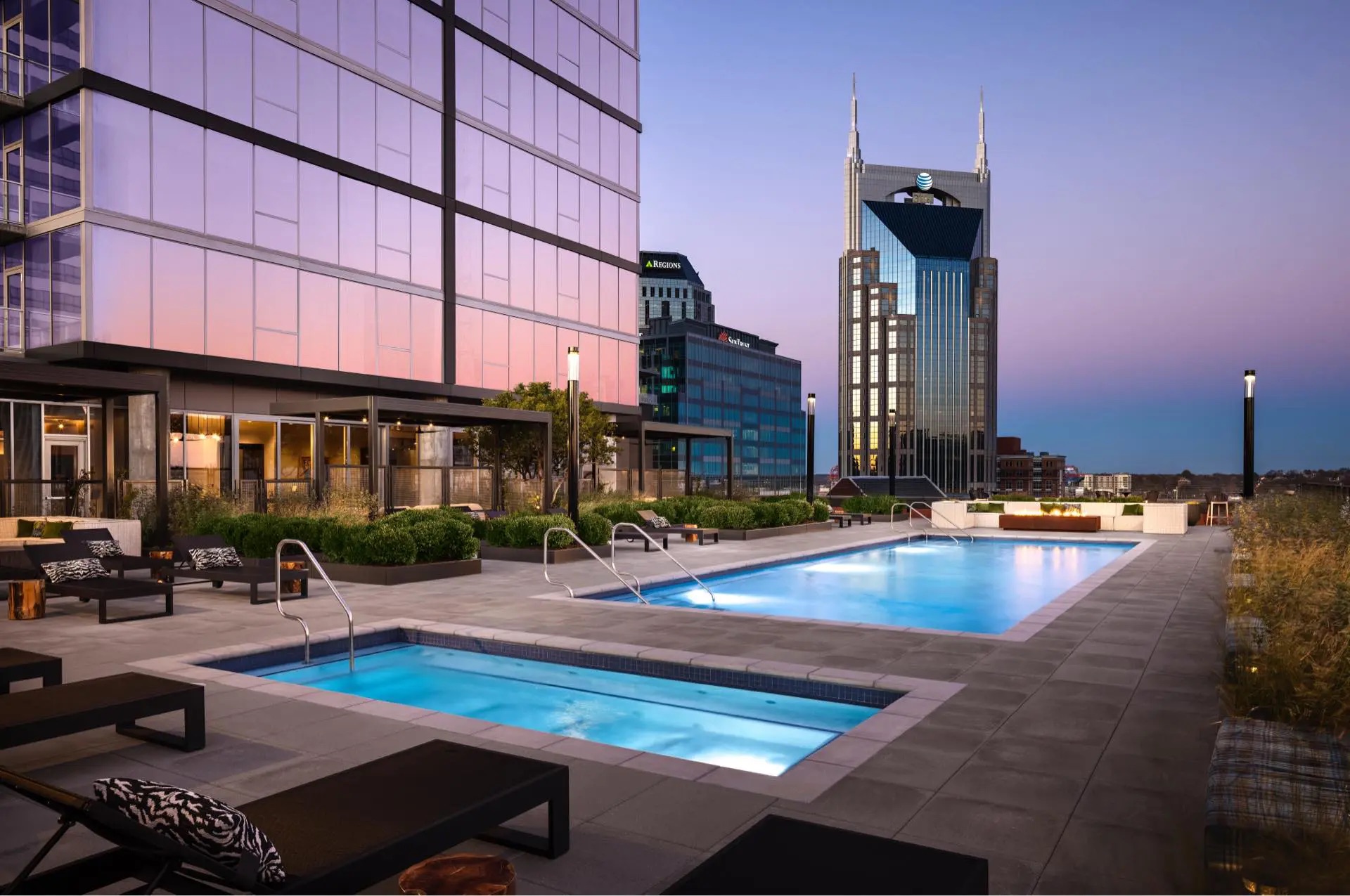 The Place exterior pool deck at dusk